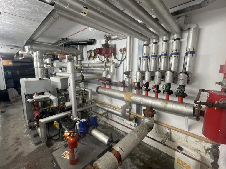 Commercial boiler plant room pipework and circulation pumps maintained by CMG Heating and Plumbing