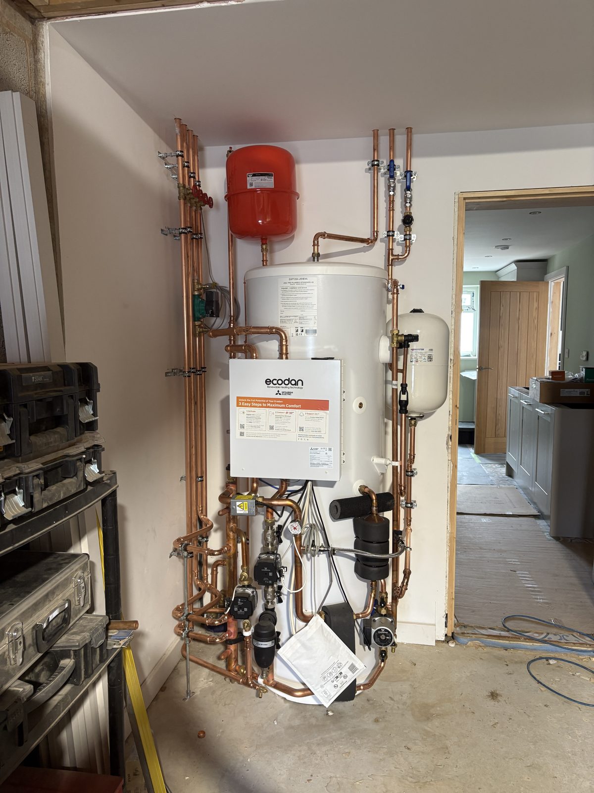 Pre-plumbed Ecodan heat pump cylinder with expansion vessels and copper pipework